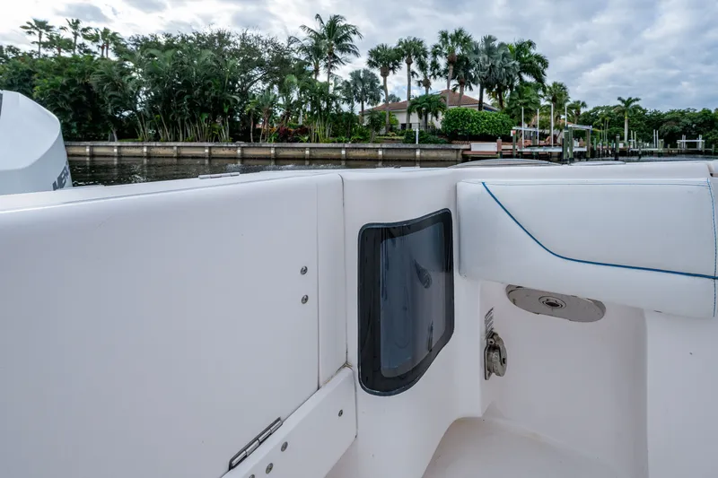Mrs Diagnosis Yacht Photos Pics 2020 Intrepid 407 Panacea boat interior with waterfront view and lush greenery.