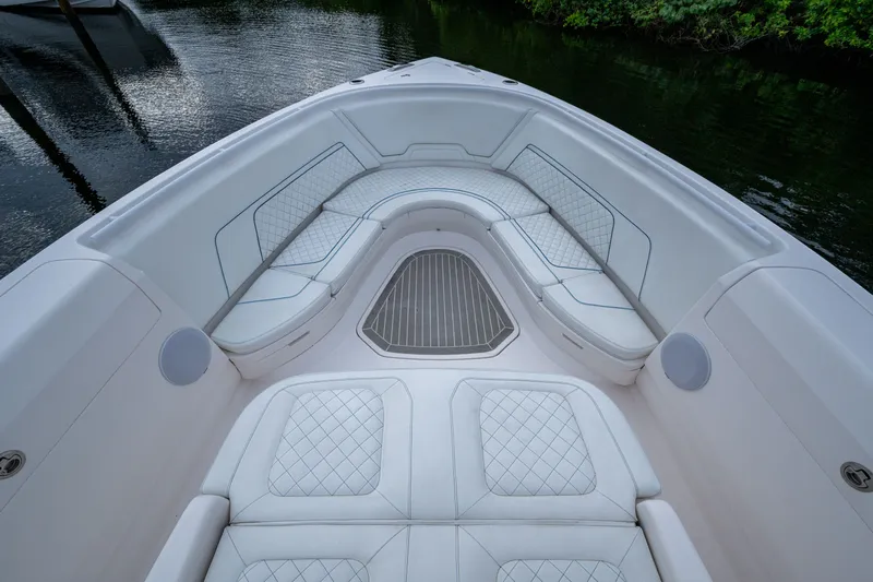 Mrs Diagnosis Yacht Photos Pics Luxurious seating area on 2020 Intrepid 407 Panacea boat, featuring elegant white upholstery.