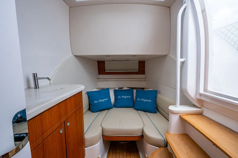 Mrs Diagnosis Yacht Photos Pics Luxurious cabin interior of 2020 Intrepid 407 Panacea with cozy seating and cushions.
