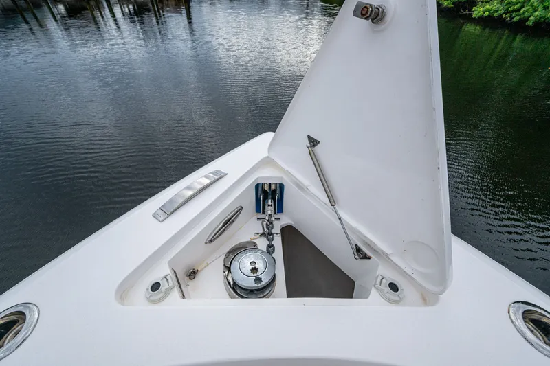 Mrs Diagnosis Yacht Photos Pics 2020 Intrepid 407 Panacea boat anchor compartment, open on calm water.