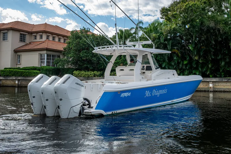 Mrs Diagnosis Yacht Photos Pics 2020 Intrepid 407 Panacea boat with triple Mercury engines on a scenic waterway.