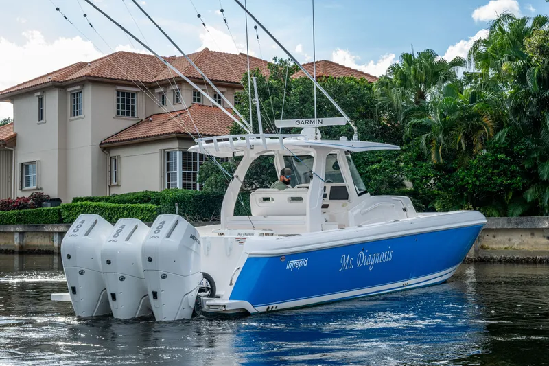 Mrs Diagnosis Yacht Photos Pics 2020 Intrepid 407 Panacea boat with triple engines on a scenic waterway.