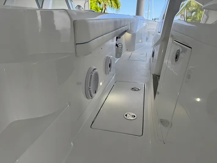  Yacht Photos Pics Interior view of 2025 Intrepid 41 Panacea boat, featuring sleek white design and modern fixtures.