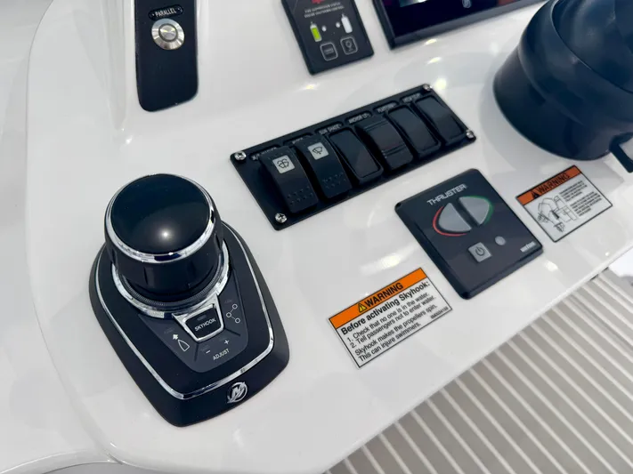  Yacht Photos Pics Control panel of 2025 Intrepid 41 Panacea boat featuring joystick and thruster controls.