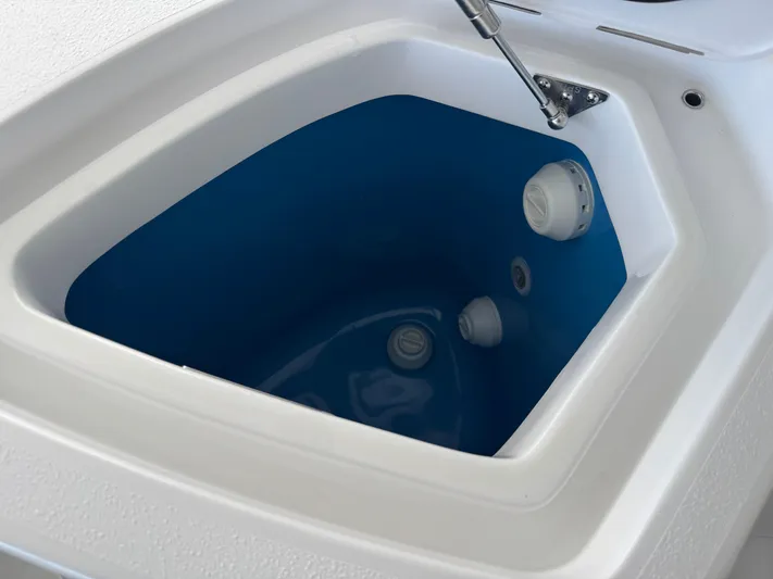  Yacht Photos Pics Livewell compartment on 2025 Intrepid 41 Panacea boat, featuring a blue interior and white exterior.