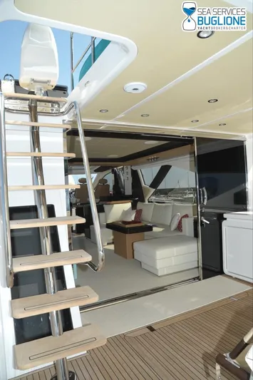 Elisa II Yacht Photos Pics 2018 Azimut 77 S yacht interior with modern seating and wooden staircase.