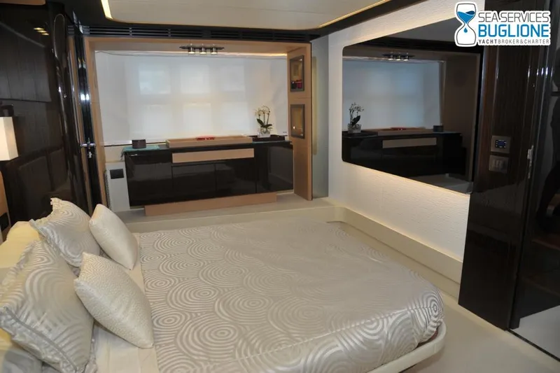 Elisa II Yacht Photos Pics Luxurious bedroom interior of 2018 Azimut 77 S yacht with modern decor and elegant furnishings.