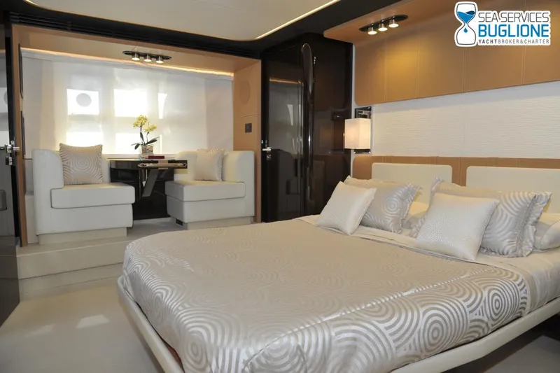 Elisa II Yacht Photos Pics Luxurious interior of 2018 Azimut 77 S yacht with elegant bedroom and seating area.