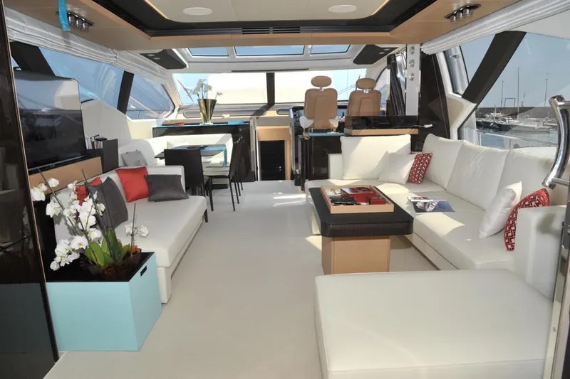 Elisa II Yacht Photos Pics Luxurious interior of 2018 Azimut 77 S yacht with modern seating and elegant decor.