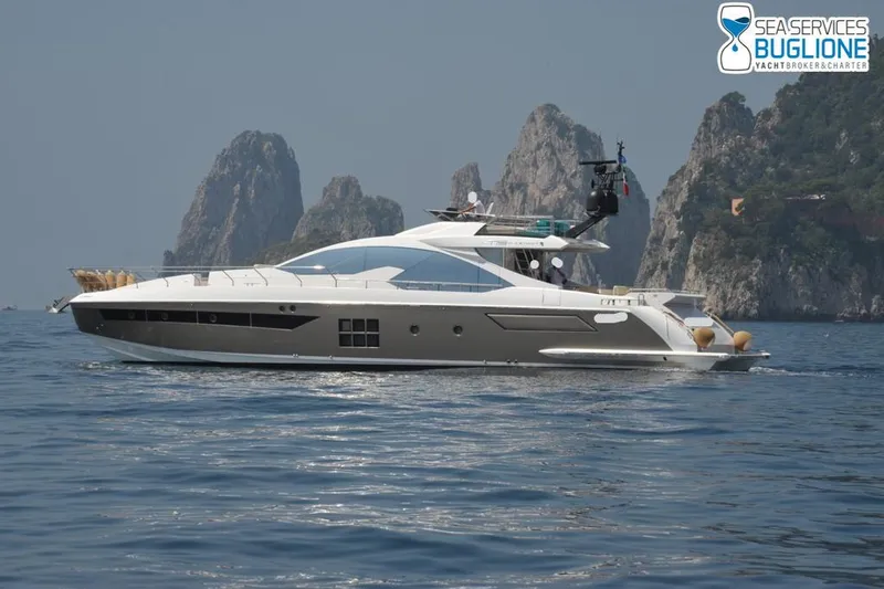 Elisa II Yacht Photos Pics 2018 Azimut 77 S yacht cruising near rocky coastline.