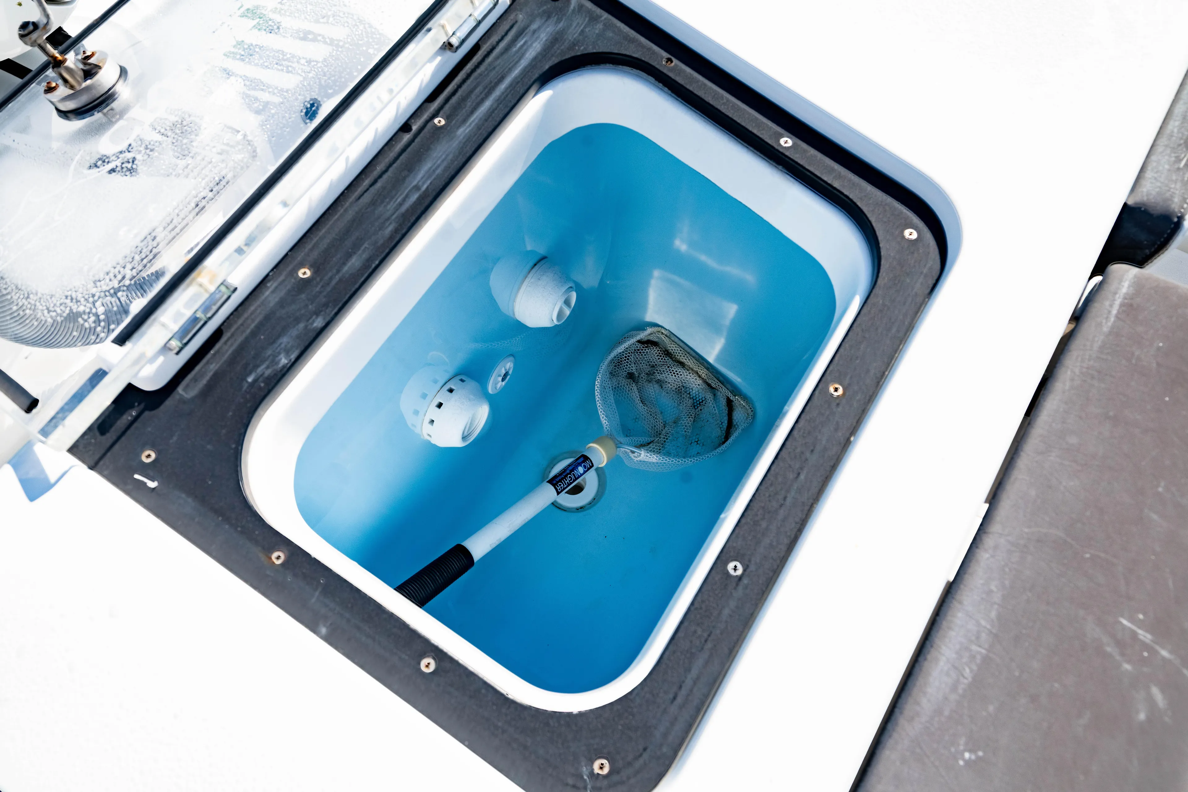  Yacht Photos Pics Livewell compartment on 2022 Crevalle 33 CSF boat with net inside.