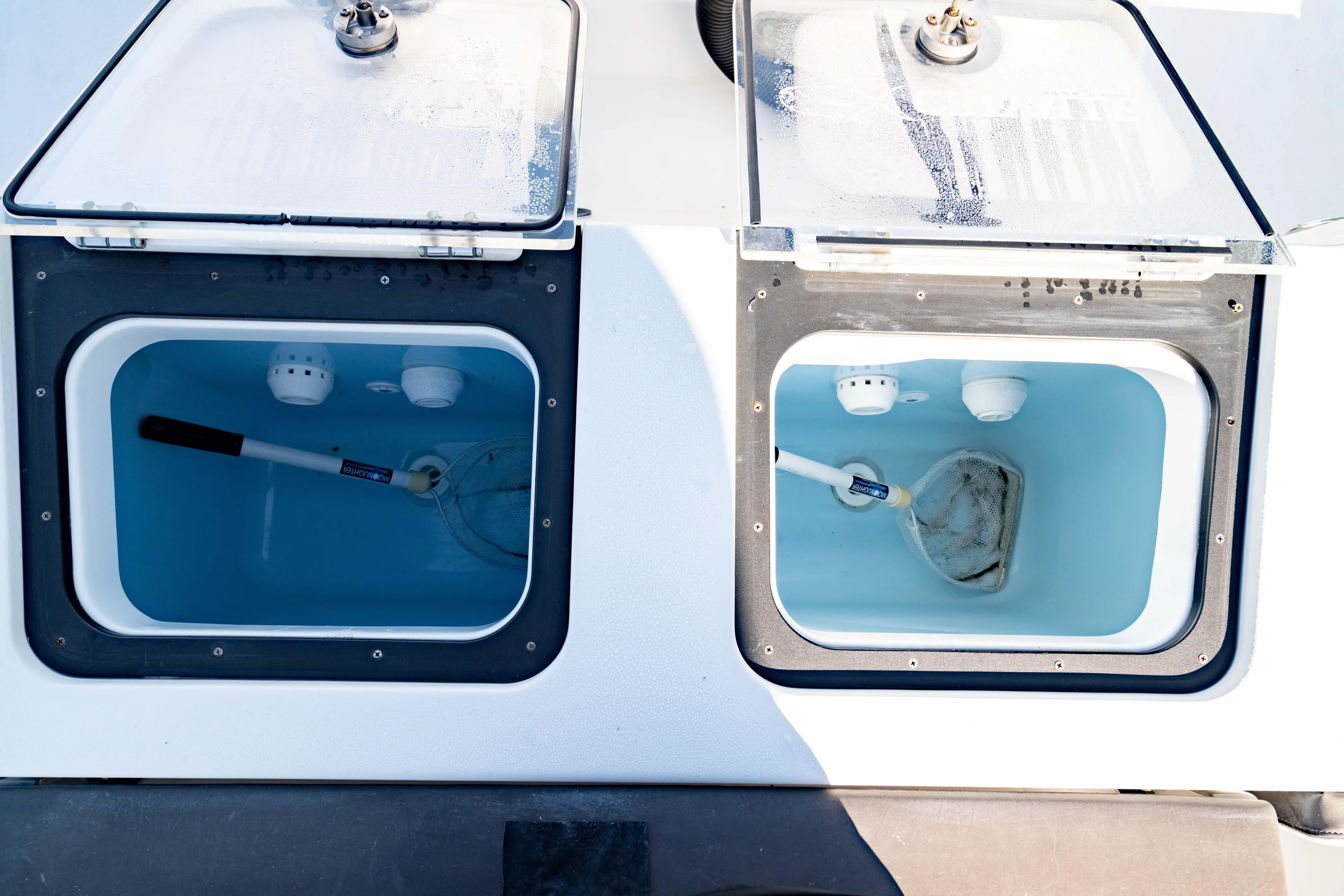  Yacht Photos Pics 2022 Crevalle 33 CSF livewell compartments with nets and water.