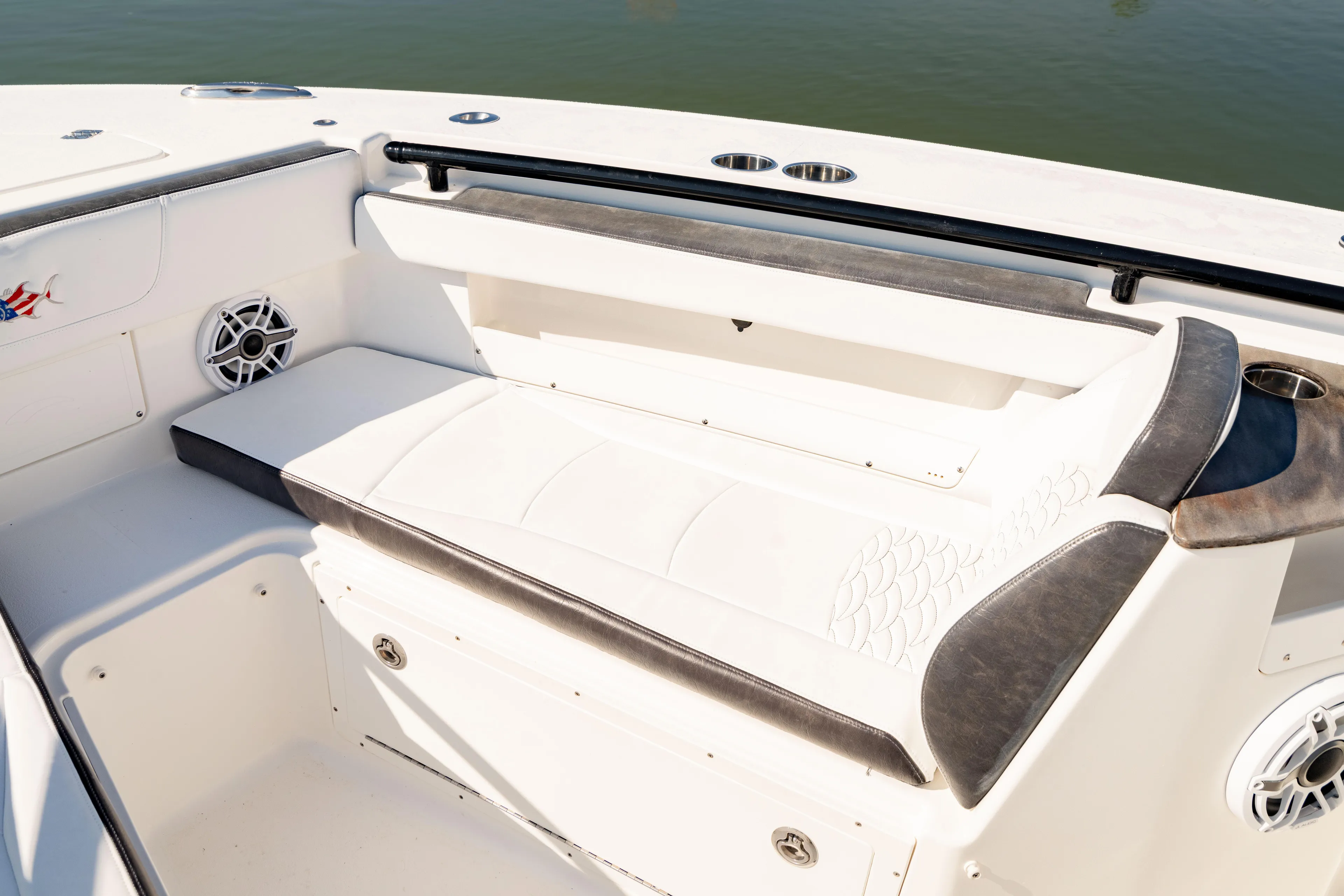  Yacht Photos Pics 2022 Crevalle 33 CSF boat interior with cushioned seating and cup holders.