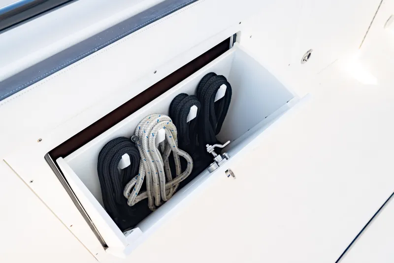  Yacht Photos Pics Storage compartment with ropes on a 2022 Crevalle 33 CSF boat.