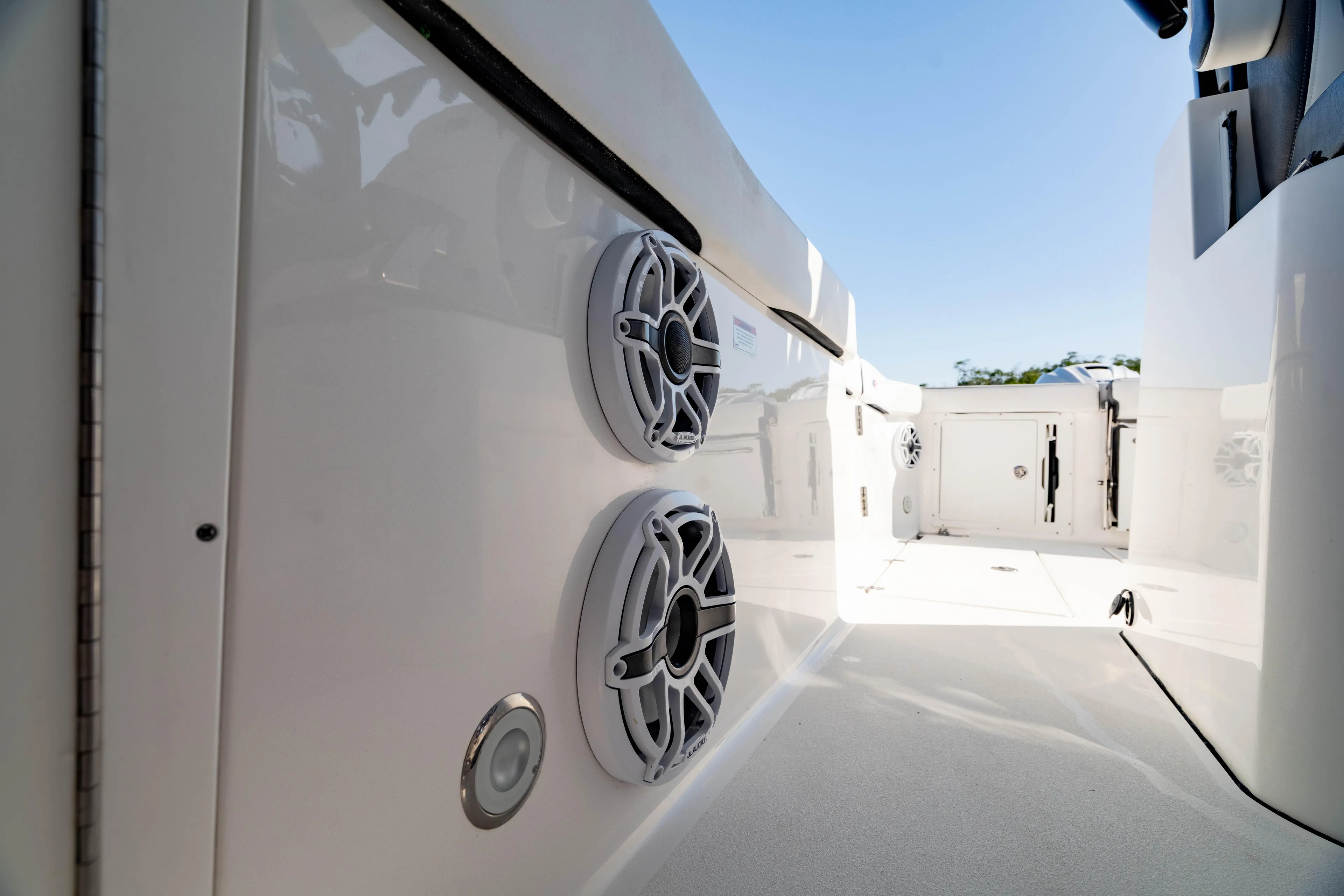  Yacht Photos Pics 2022 Crevalle 33 CSF boat interior with speakers and sleek design.