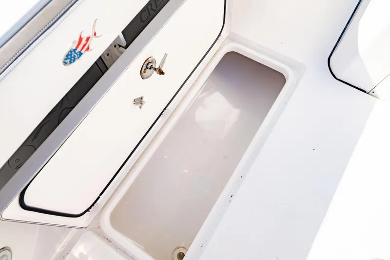  Yacht Photos Pics 2022 Crevalle 33 CSF boat storage compartment with American flag fish decal.