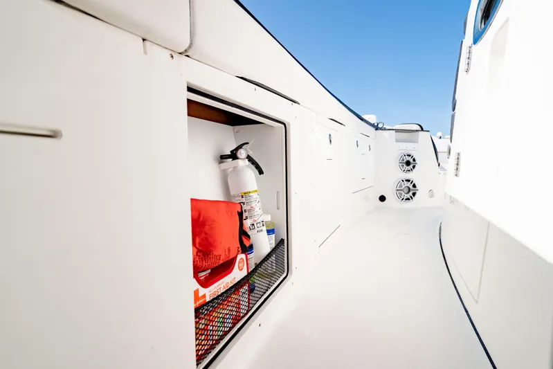  Yacht Photos Pics 2022 Crevalle 33 CSF boat storage with safety equipment and speakers.