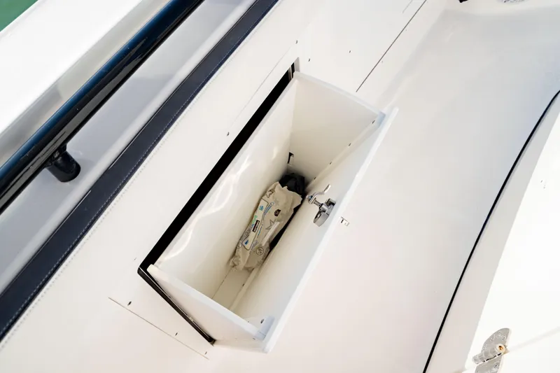  Yacht Photos Pics 2022 Crevalle 33 CSF boat storage compartment with safety equipment.
