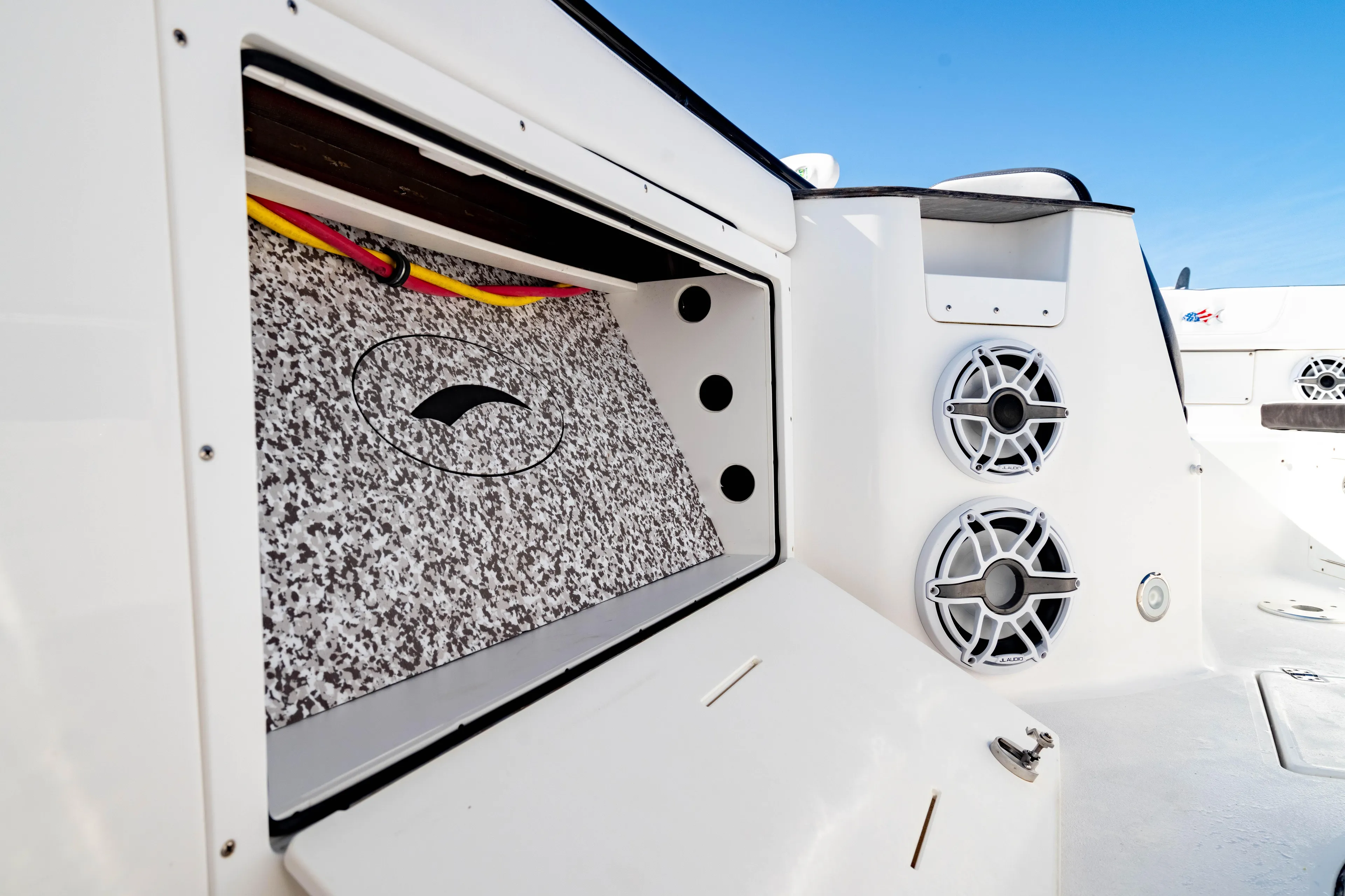  Yacht Photos Pics 2022 Crevalle 33 CSF boat interior with storage compartment and speakers.