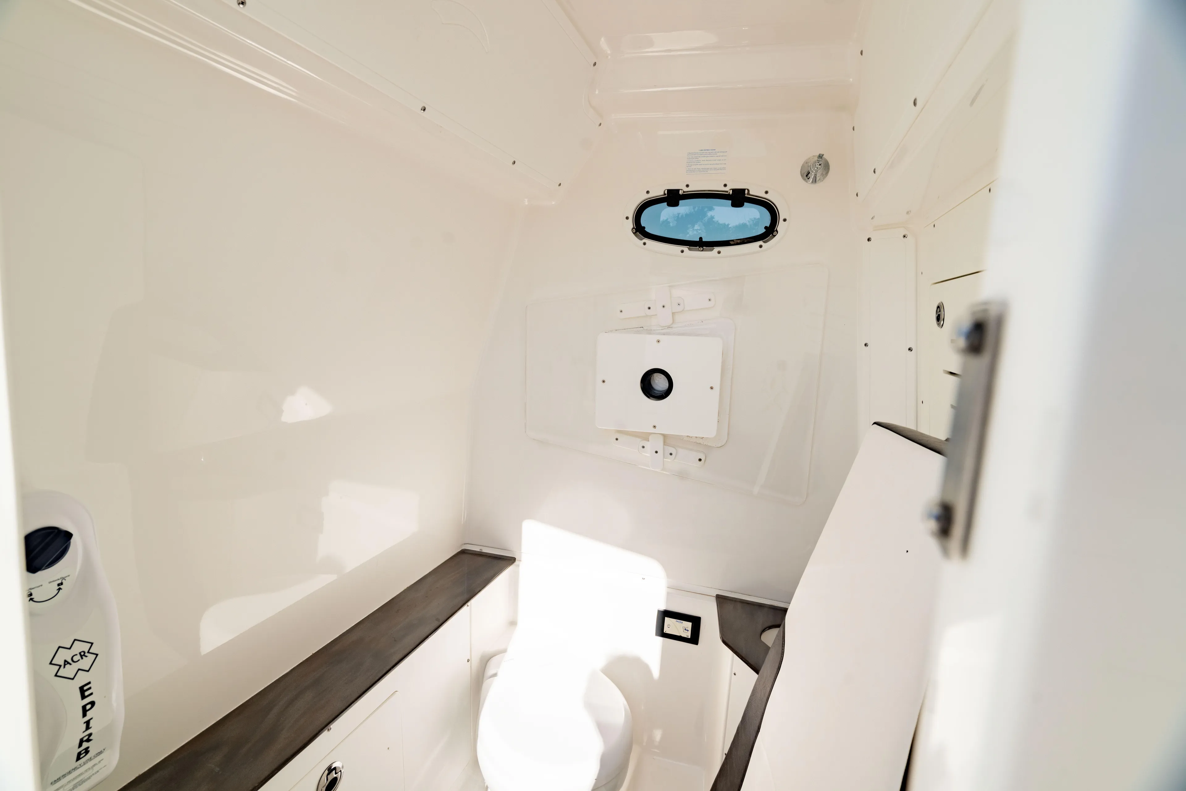  Yacht Photos Pics Interior of 2022 Crevalle 33 CSF boat, featuring a compact marine toilet.
