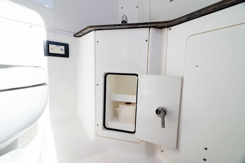  Yacht Photos Pics 2022 Crevalle 33 CSF boat interior with storage compartment and control panel.