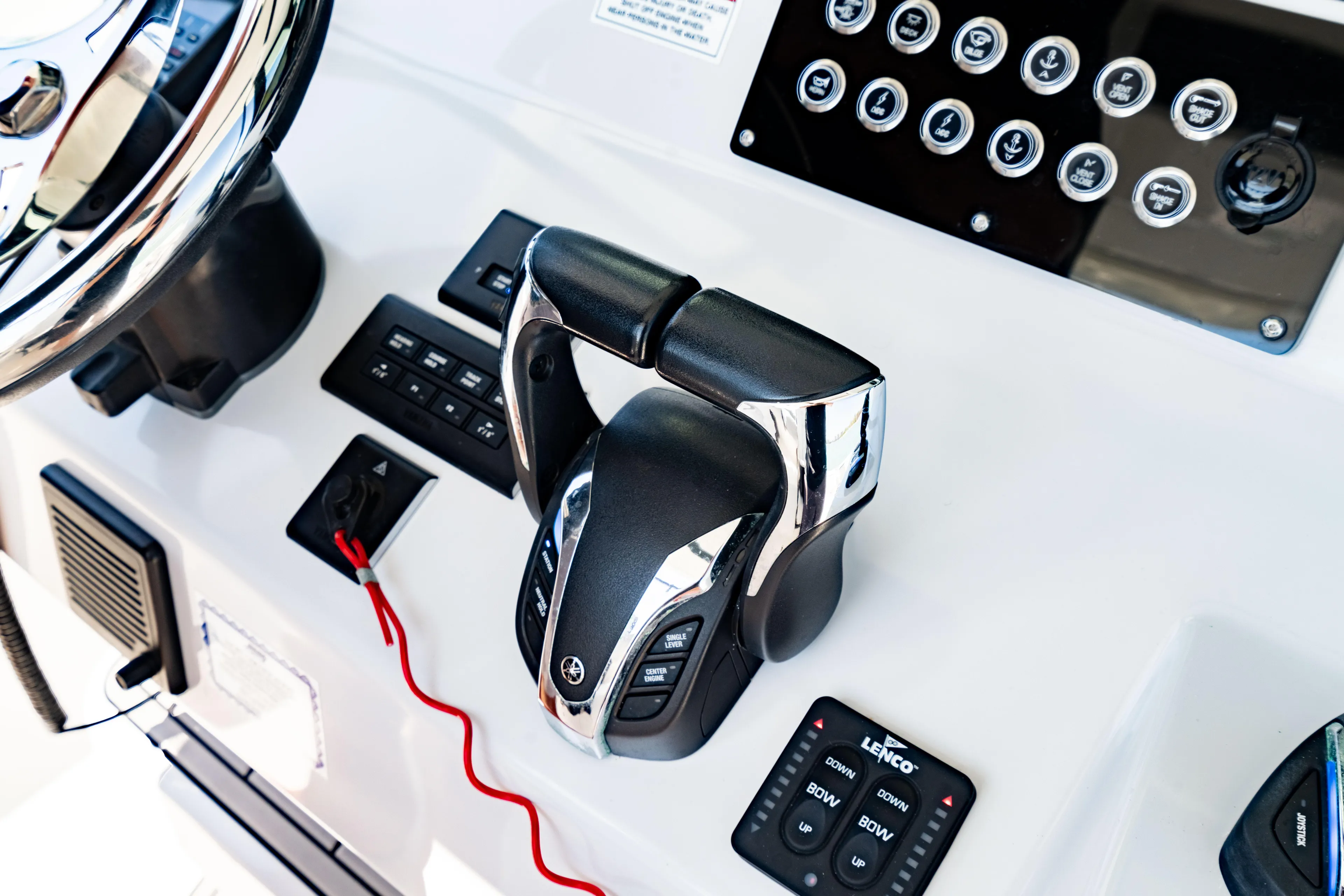  Yacht Photos Pics Control panel of 2022 Crevalle 33 CSF boat with steering and throttle.