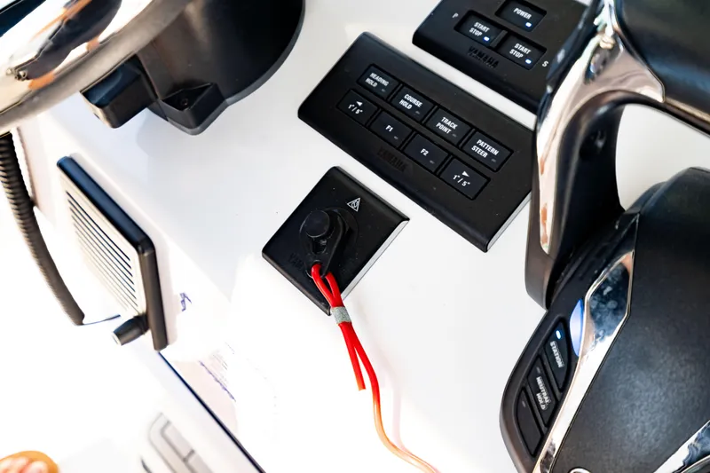  Yacht Photos Pics 2022 Crevalle 33 CSF boat dashboard with controls and steering wheel.