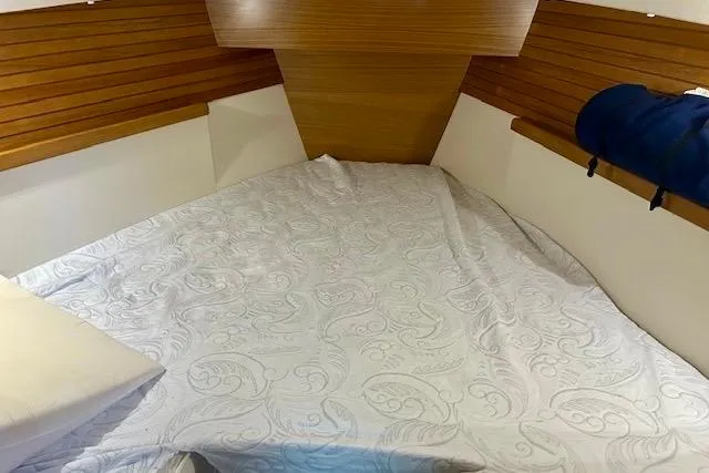  Yacht Photos Pics 2015 Catalina 315 yacht interior with cozy bed and wooden paneling.