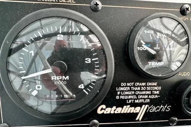  Yacht Photos Pics Dashboard of a 2015 Catalina 315 yacht showing RPM and temperature gauges.