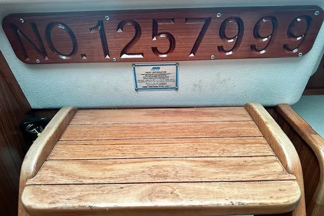  Yacht Photos Pics Catalina 315 sailboat, 2015 model, with registration number 125799 displayed on wooden panel.