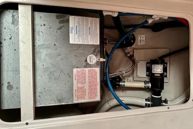  Yacht Photos Pics Engine compartment of a 2015 Catalina 315 sailboat, featuring various mechanical components.