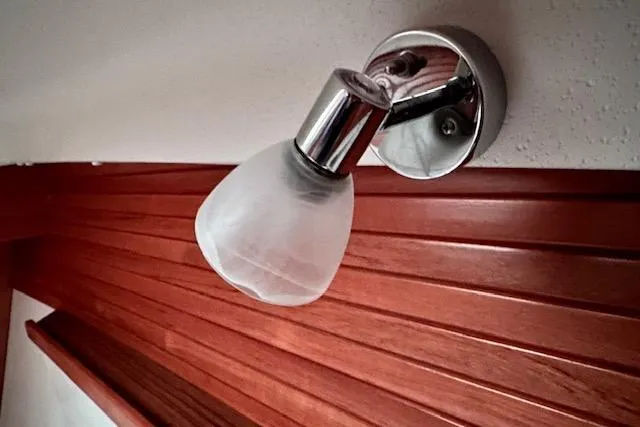  Yacht Photos Pics Wall-mounted light fixture in a 2015 Catalina 315 boat interior.