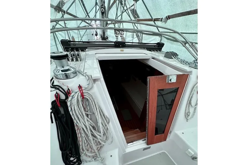 Yacht Photos Pics 2015 Catalina 315 sailboat cockpit with ropes and open cabin door.