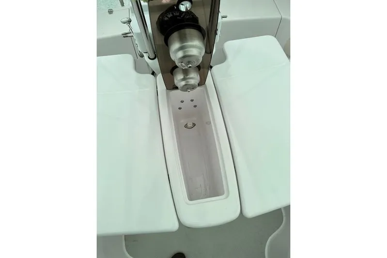  Yacht Photos Pics Cockpit view of a 2015 Catalina 315 sailboat, featuring a central steering pedestal.