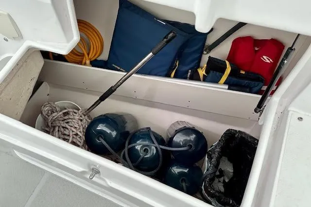  Yacht Photos Pics Storage compartment of 2015 Catalina 315 sailboat with ropes, fenders, and life jackets.