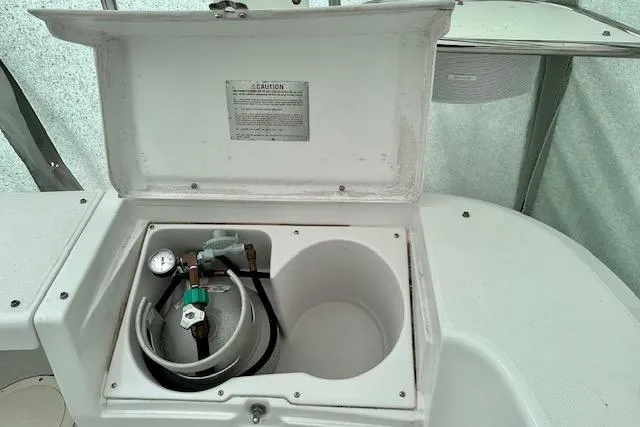  Yacht Photos Pics Open storage compartment on 2015 Catalina 315 boat with gas cylinder and gauge.