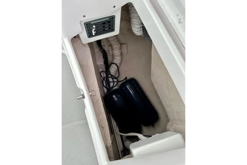 Yacht Photos Pics Storage compartment of a 2015 Catalina 315 sailboat with control panel and equipment.