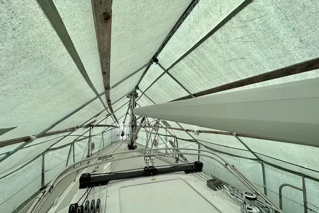  Yacht Photos Pics Covered 2015 Catalina 315 sailboat under protective tarp, showcasing deck and rigging.