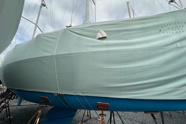  Yacht Photos Pics 2015 Catalina 315 sailboat covered, docked on stands, with blue hull visible.