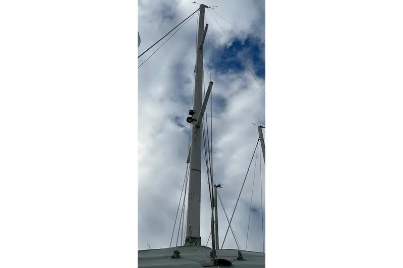  Yacht Photos Pics Mast of a 2015 Catalina 315 sailboat against a cloudy sky.