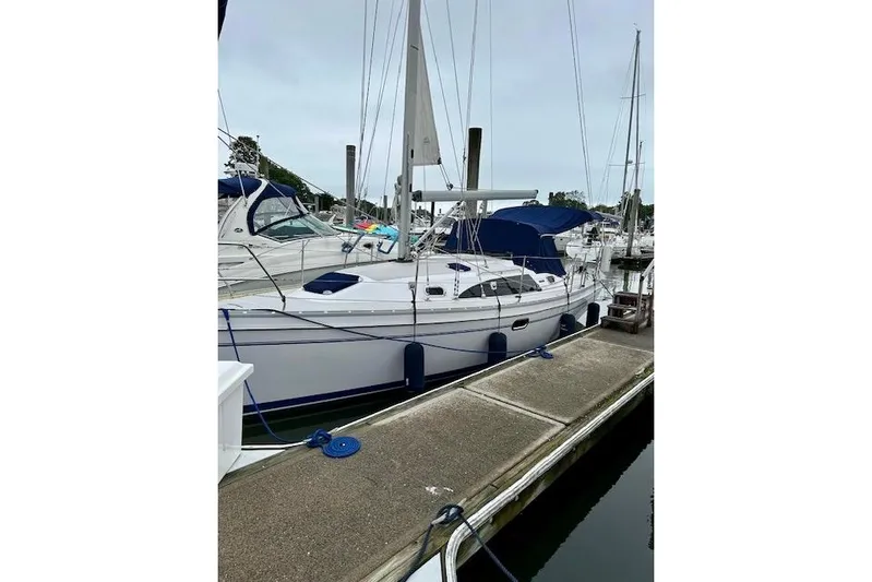  Yacht Photos Pics 2015 Catalina 315 sailboat docked at marina, featuring sleek design and blue accents.