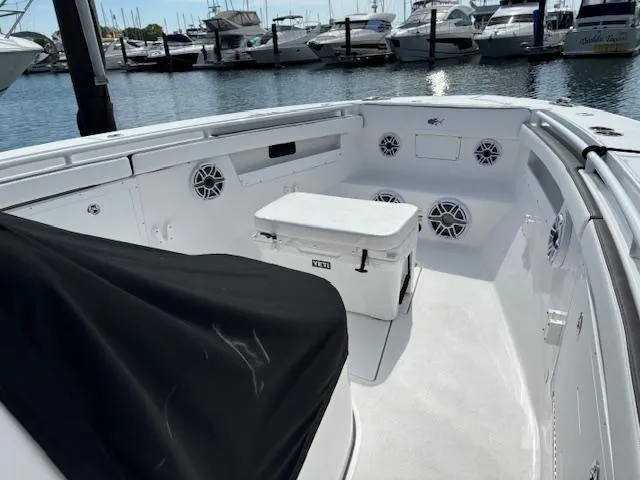  Yacht Photos Pics 2025 Crevalle 33 CTF boat interior with speakers and cooler, docked at marina.
