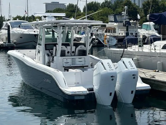  Yacht Photos Pics 2025 Crevalle 33 CTF boat docked with twin outboard engines.