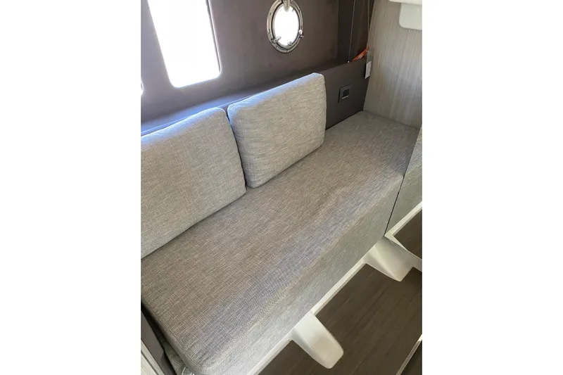  Yacht Photos Pics Interior seating of 2020 Cranchi M 44 HT yacht with gray cushions.