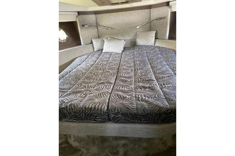 Yacht Photos Pics Luxurious bedroom interior of 2020 Cranchi M 44 HT yacht with patterned bedding.