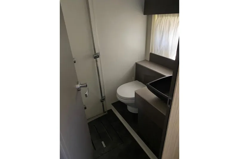  Yacht Photos Pics 2020 Cranchi M 44 HT yacht bathroom with modern fixtures and sleek design.