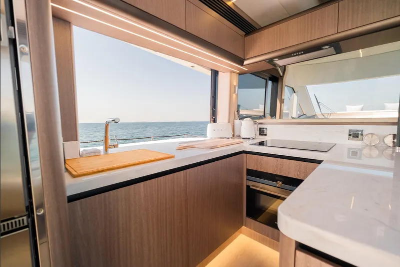  Yacht Photos Pics Luxurious kitchen interior of 2025 Galeon 560 Fly yacht with ocean view.