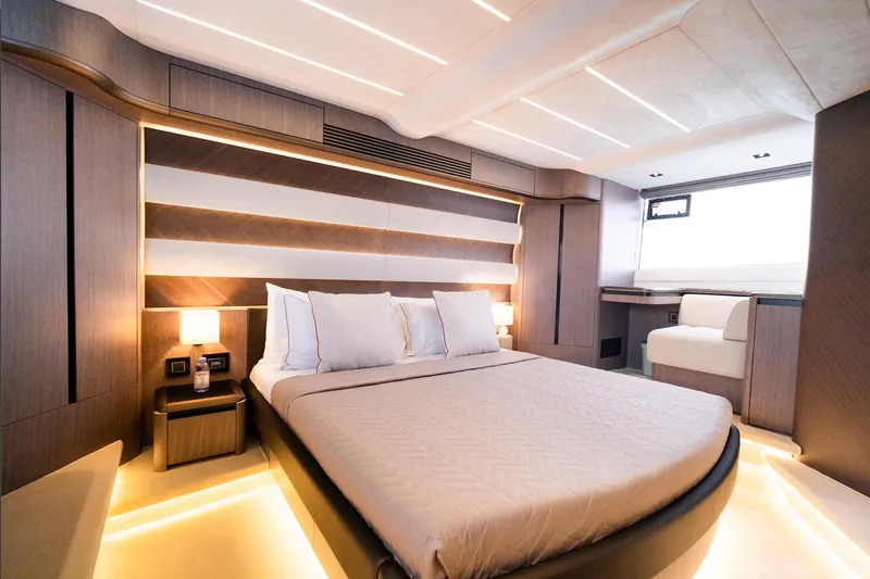  Yacht Photos Pics Luxurious bedroom interior of 2025 Galeon 560 Fly yacht, featuring modern design and ambient lighting.