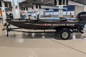 2025 Tracker Panfish 17 boat on display in a showroom, side view.