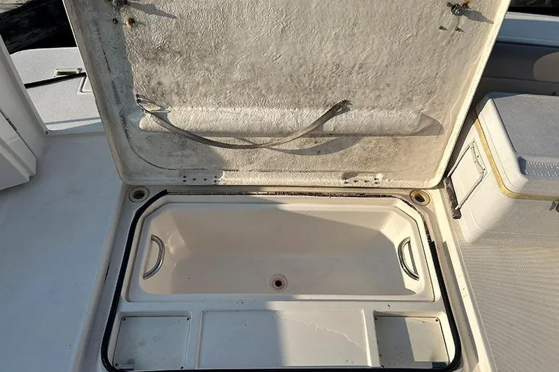  Yacht Photos Pics Open storage compartment on a 2002 Silverton 42 Convertible boat deck.